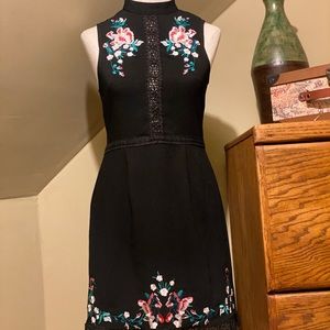 Embroidered black mini dress lace trim and hem